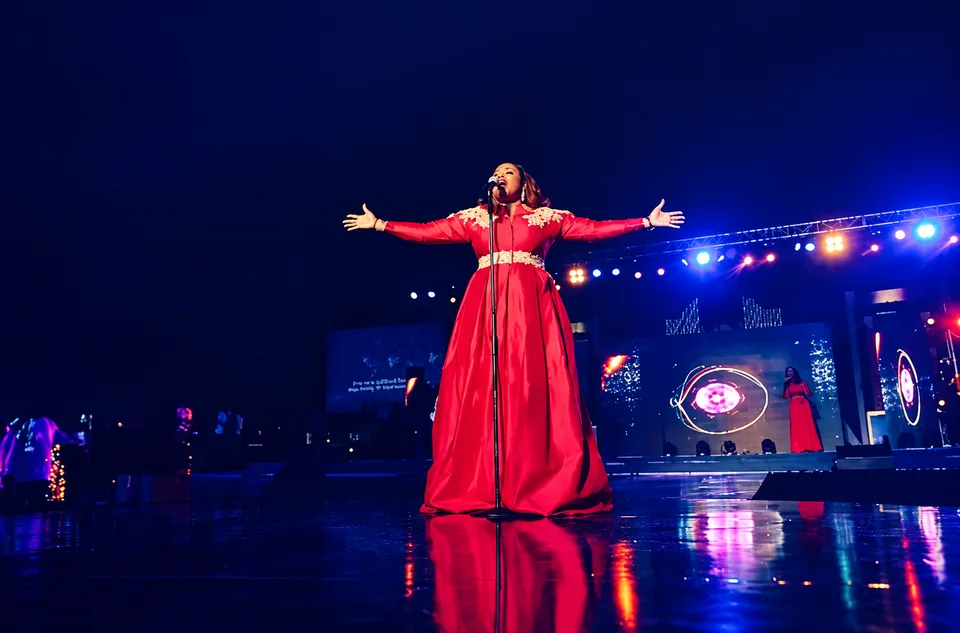 Singer on a blue-lit concert stage, from Cosmic Media’s gallery